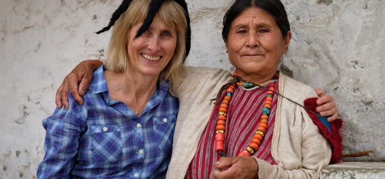 Clare, making friends and sharing hats at Tawang Monastery.